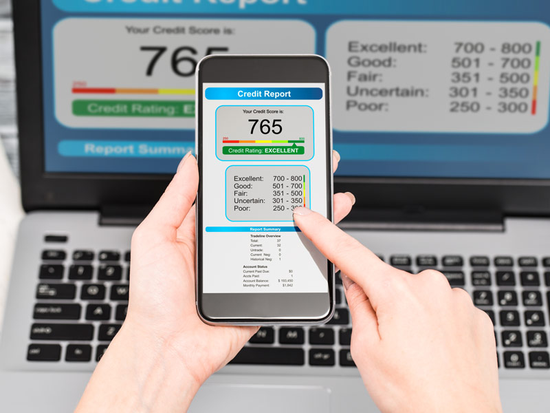 A person is checking their FICO credit score on their phone.